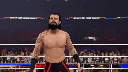 a man in a wrestling ring with his arms outstretched in front of a banner that says survivor on it