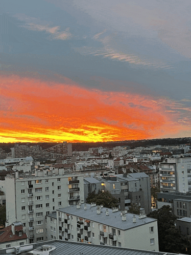 an aerial view of a city at sunset