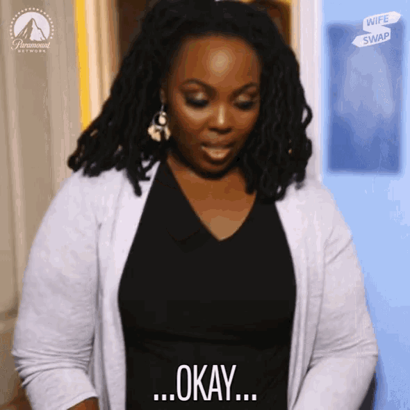 a woman with dreadlocks says okay in front of a sign that says wife swap