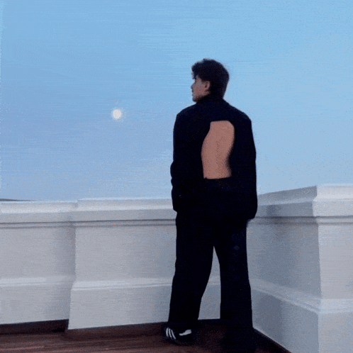 a blurry picture of a person standing in front of a window