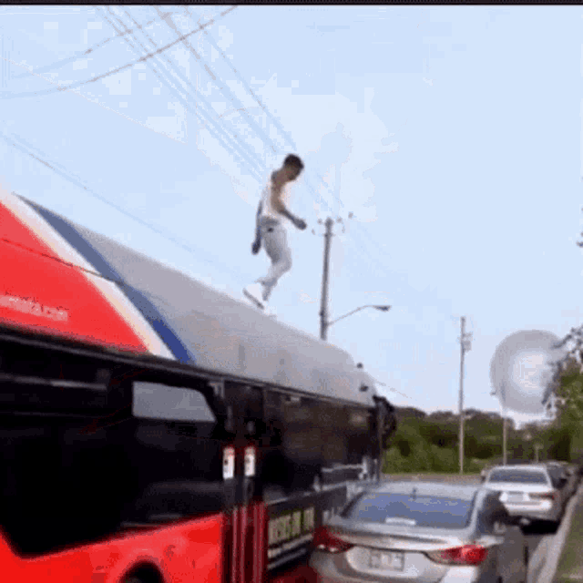 a man is jumping off the side of a bus with a sign on it that says ' where ' on it