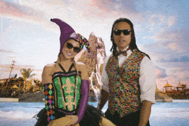 a man and a woman are posing for a picture