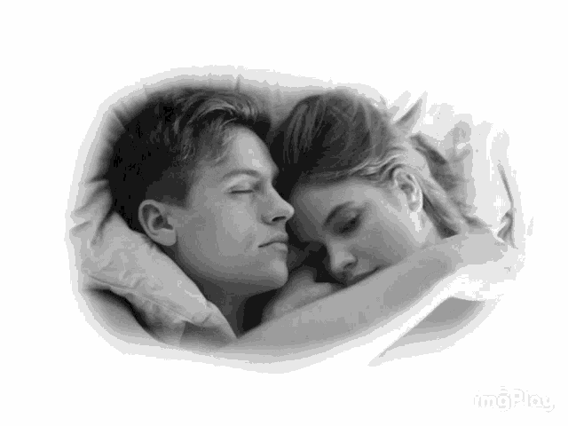 a black and white photo of a man and a woman hugging