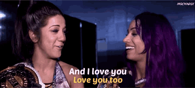 two women with purple hair and the words and i love you love you too behind them