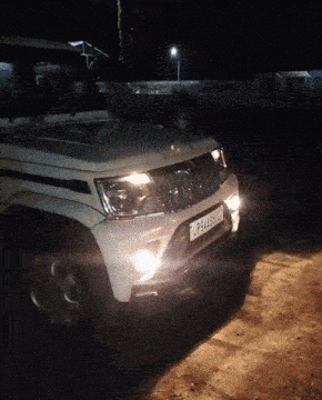 a white jeep with a license plate that says twp-ea48bnx