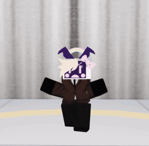 a cartoon character with the letter f on his head sits on a chair