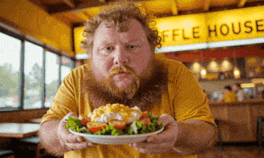 a man holds a plate of food in front of a waffle house sign
