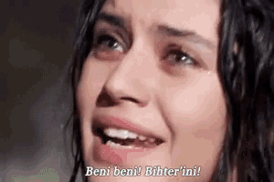 a close up of a woman 's face with a caption that says beni beni bitter ini .