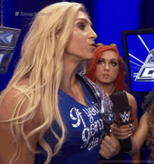 a woman wearing a blue tank top that says if you don 't do it
