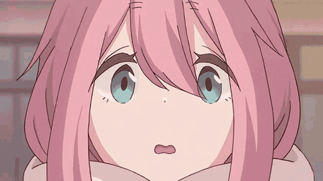 a girl with pink hair and blue eyes is making a surprised face