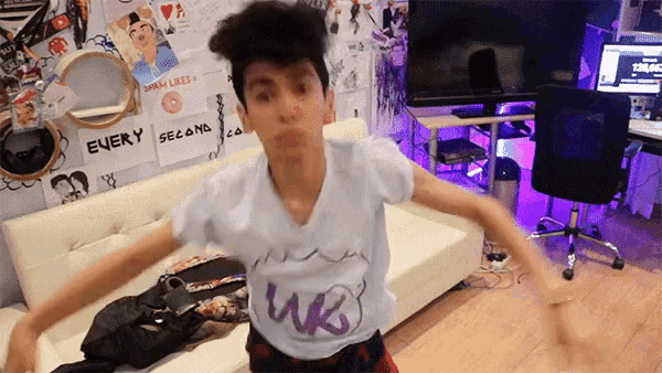 a boy wearing a white shirt with the word wg on it