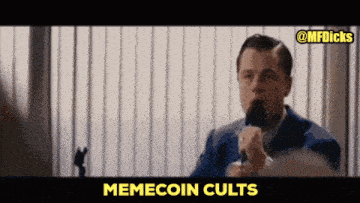 a man speaking into a microphone with memecoin cults written on the bottom