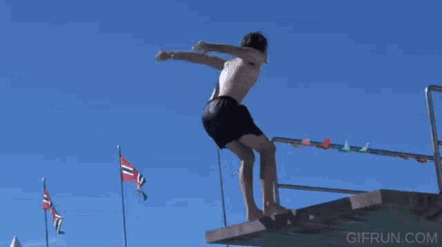 a person is doing a handstand in front of a relay sign
