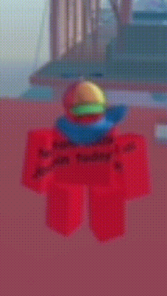 a blurred image of a red toy with a hamburger on top