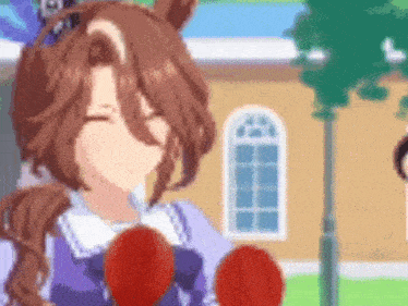 a girl in a purple dress is holding a pair of red boxing gloves .