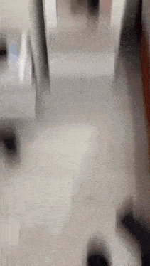 a blurry picture of a person standing in front of a mirror in a bathroom .