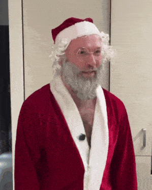 a man dressed as santa claus with a white beard and glasses