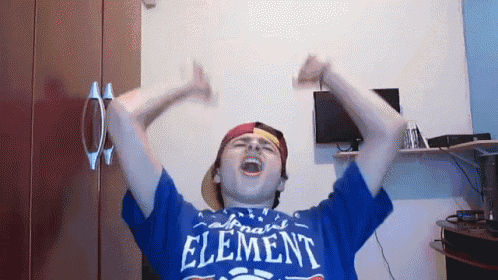 a young man wearing a blue shirt that says element