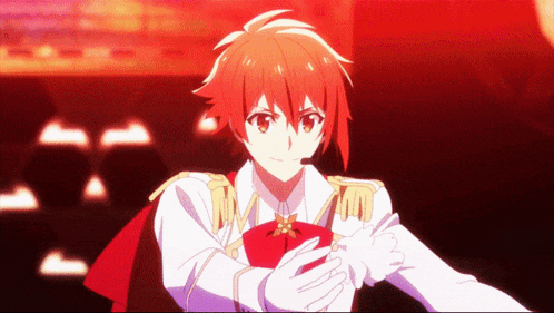 a boy with red hair and white gloves is wearing a red cape