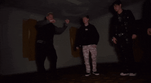 a blurry picture of a person 's legs in a dark room