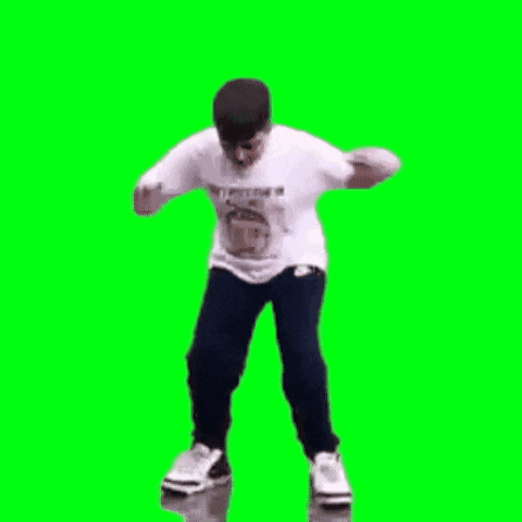 a man in a white shirt and black pants is dancing in front of a green screen .