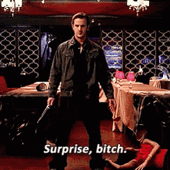 a man holding a gun standing in a room with surprise bitch written on the bottom
