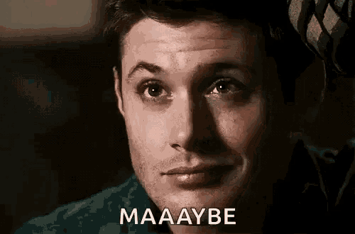 a close up of a man 's face with the words `` maaaybe '' written next to him .