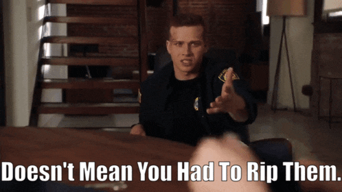 a man sitting at a table with the words " doesn 't mean you had to rip them "
