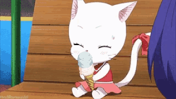 a white cat is sitting on a bench eating ice cream