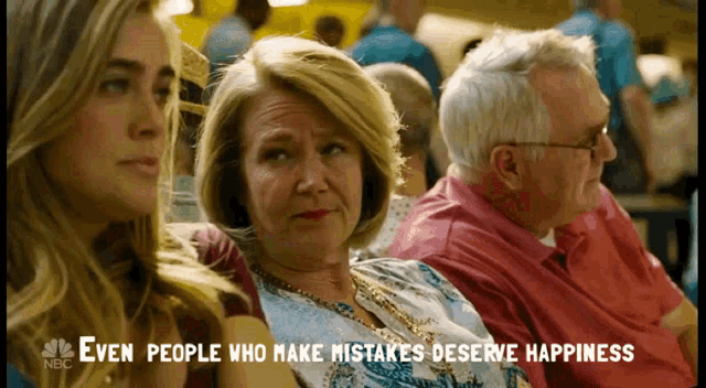 a group of people are sitting in a room with the words " even people who make mistakes deserve happiness " above them