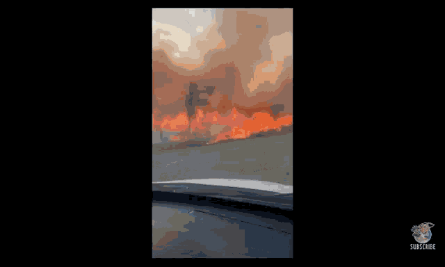 a car is driving down a highway with smoke coming out of it