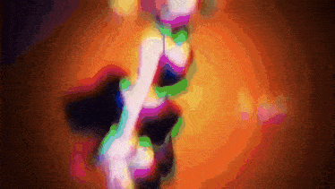 a blurred image of a woman 's legs with a rainbow of colors