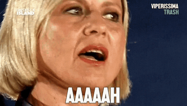 a close up of a woman 's face with the word aaaah written on it