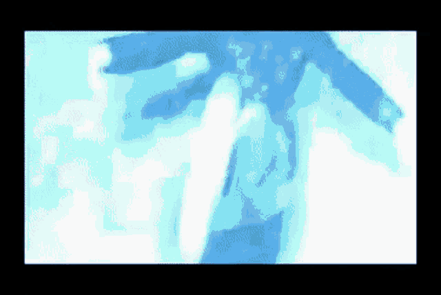 a blurry picture of a person 's hand reaching out in the air