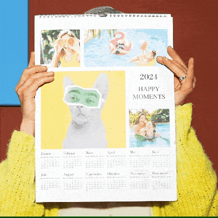 a person holding a calendar that says happy moments