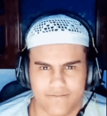 a man wearing headphones and a white headband .