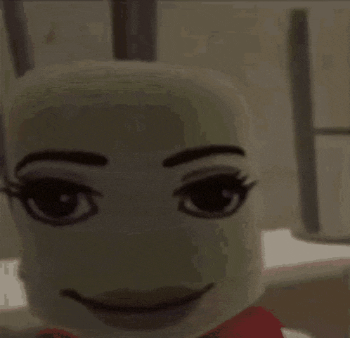 a close up of a cartoon character 's face with a smiling face .