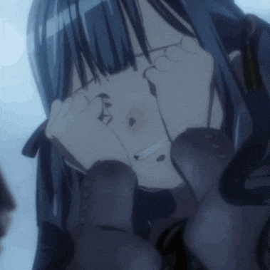 a close up of a girl covering her eyes with her hands