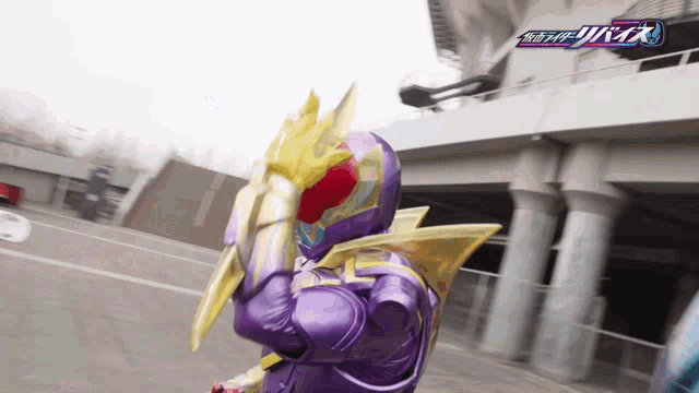 a person in a purple and gold costume is holding a sword
