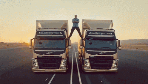 Jean-claude Van Damme Does Epic Splits Between Two Trucks GIF - Jean Claude Van Damme Splits Flexibility GIFs
