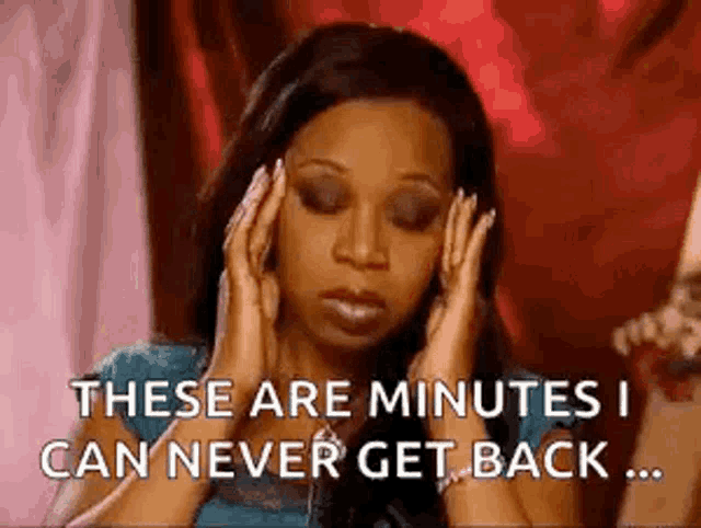 a woman is holding her head and says `` these are minutes i can never get back '' .