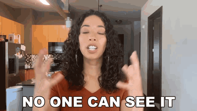 a woman says no one can see it in front of a kitchen