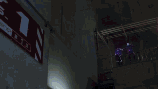 a person is standing in a dark room with a red and blue light behind them