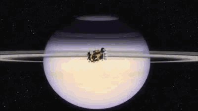 an artist 's impression of a space ship flying around saturn 's rings .