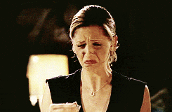 a woman is making a funny face with her mouth wide open