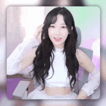 a woman with long black hair is wearing a white crop top and white gloves