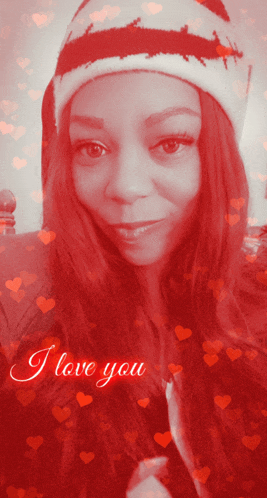 a woman wearing a santa hat is surrounded by hearts and says i love you