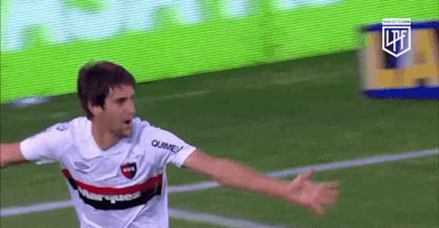 a soccer player wearing a jersey that says quimey