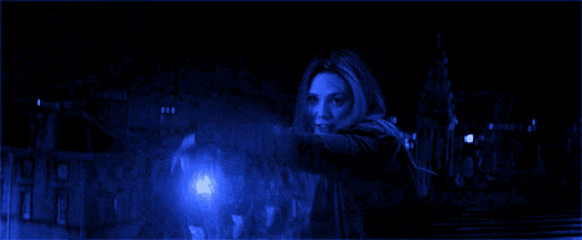 a dark blue background with a few lights coming out of it