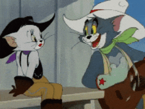 tom and jerry are sitting on a bench and talking